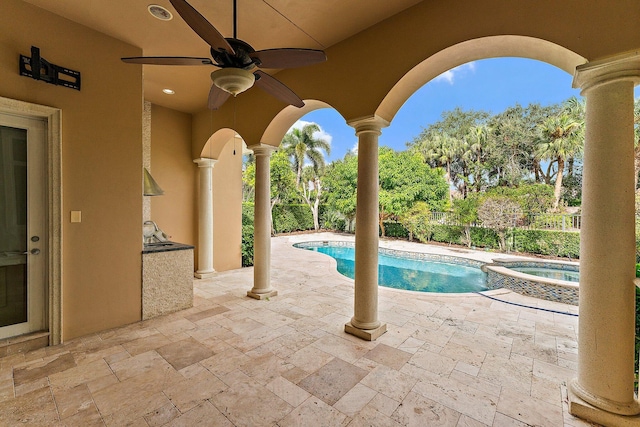 view of swimming pool featuring an in ground hot tub, ceiling fan, and a patio