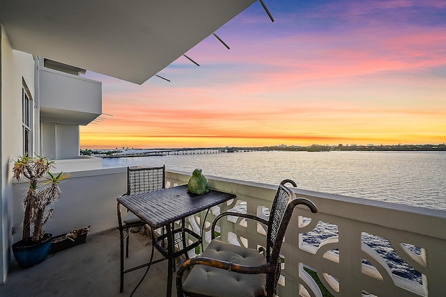 balcony at dusk with a water view