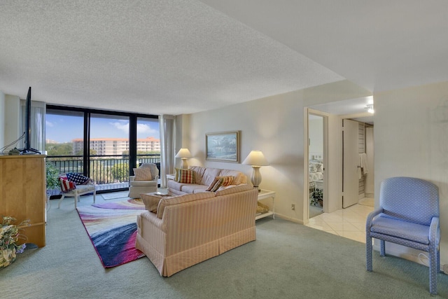 carpeted living room featuring floor to ceiling windows and a textured ceiling