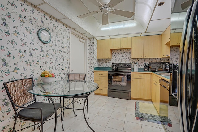 kitchen featuring ceiling fan, light brown cabinets, light tile patterned floors, and black appliances