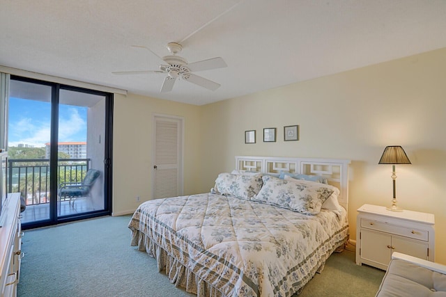 carpeted bedroom with ceiling fan, access to outside, a wall of windows, and a closet