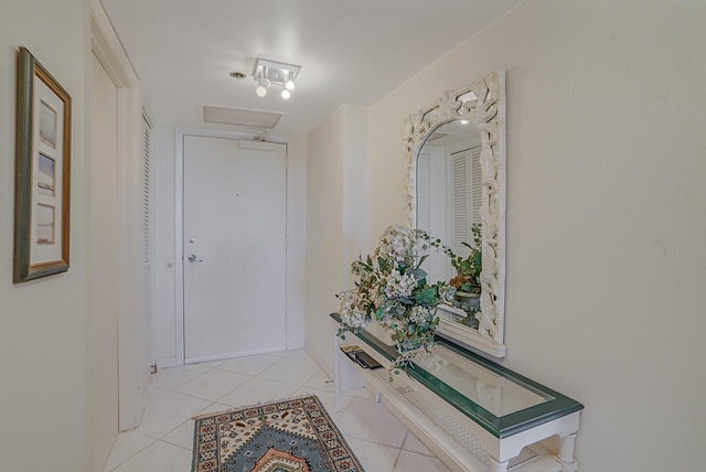 hallway with light tile patterned floors