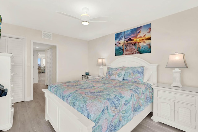 bedroom featuring ceiling fan and light wood-type flooring