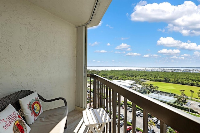 balcony featuring a water view