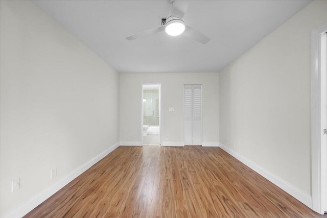 1714 Palmland Dr Unit 1714, Boynton Beach, FL 33436 - spare room featuring a ceiling fan, wood finished floors, and baseboards