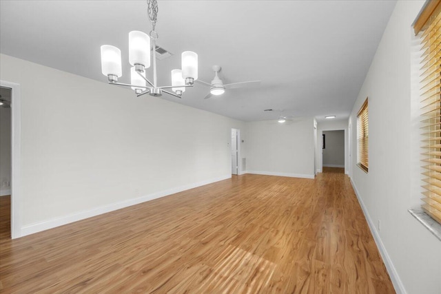 1714 Palmland Dr Unit 1714, Boynton Beach, FL 33436 - empty room with a chandelier, light wood finished floors, a ceiling fan, and baseboards