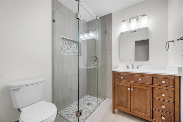 1714 Palmland Dr Unit 1714, Boynton Beach, FL 33436 - bathroom featuring toilet, vanity, and a shower stall