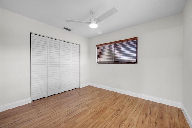 1714 Palmland Dr Unit 1714, Boynton Beach, FL 33436 - unfurnished bedroom featuring light wood finished floors, baseboards, a closet, and a ceiling fan