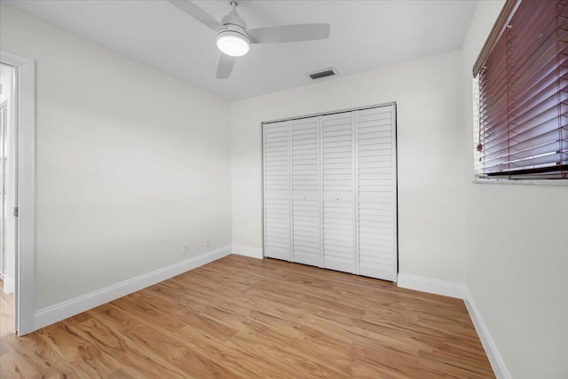 1714 Palmland Dr Unit 1714, Boynton Beach, FL 33436 - unfurnished bedroom with baseboards, light wood-style floors, a closet, and a ceiling fan