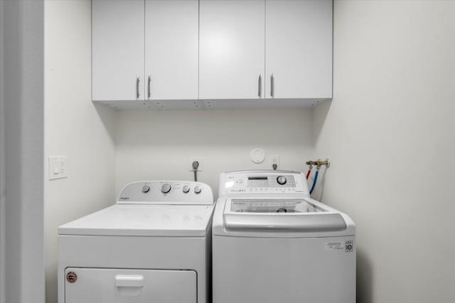1714 Palmland Dr Unit 1714, Boynton Beach, FL 33436 - laundry room featuring washer and clothes dryer and cabinet space