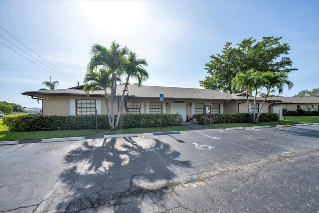 1714 Palmland Dr Unit 1714, Boynton Beach, FL 33436 - ranch-style home featuring uncovered parking and stucco siding