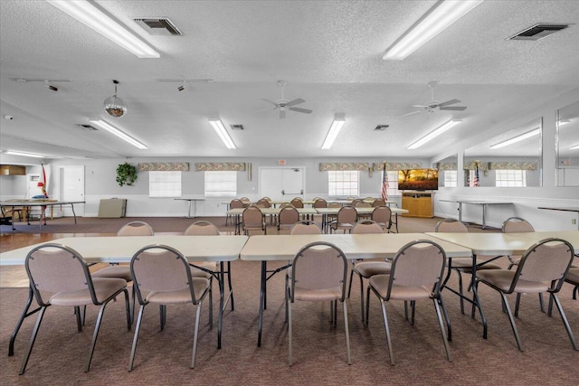 1714 Palmland Dr Unit 1714, Boynton Beach, FL 33436 - carpeted dining space featuring a textured ceiling and a ceiling fan