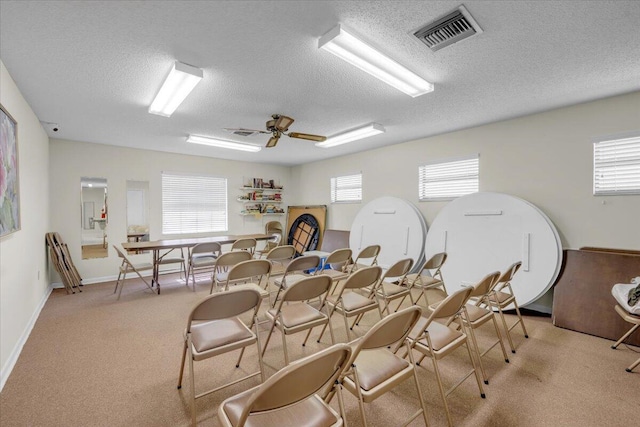 1714 Palmland Dr Unit 1714, Boynton Beach, FL 33436 - carpeted dining space featuring a textured ceiling, ceiling fan, and baseboards