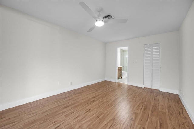 1714 Palmland Dr Unit 1714, Boynton Beach, FL 33436 - spare room with wood finished floors, ceiling fan, and baseboards