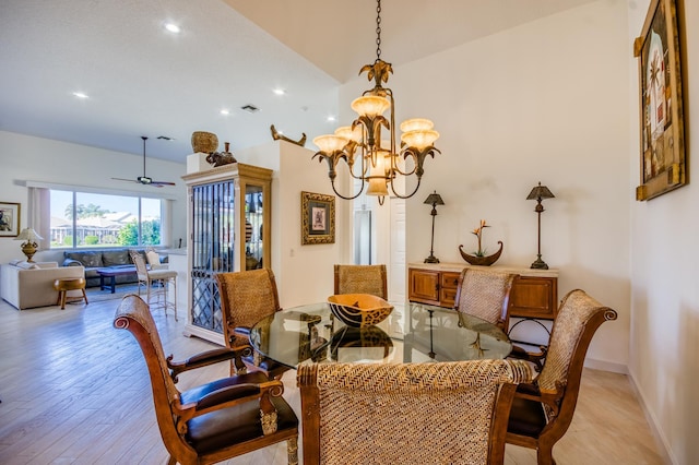 dining room with a chandelier and light wood-type flooring