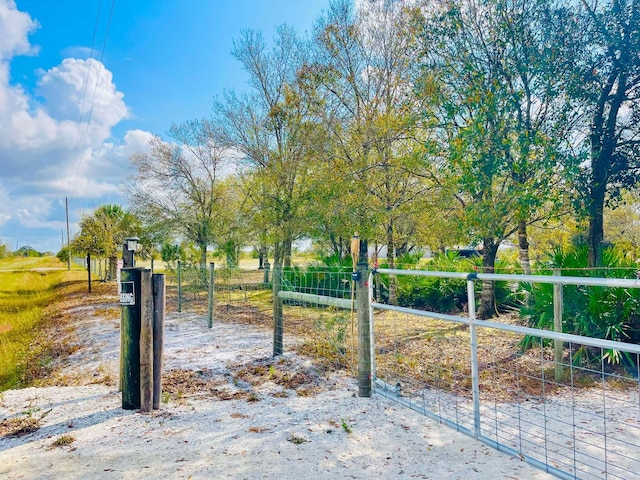 view of gate featuring fence