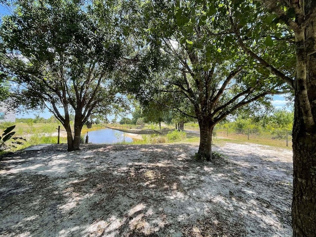 16738 NW 262nd St, Okeechobee, FL 34972 - view of yard featuring a water view
