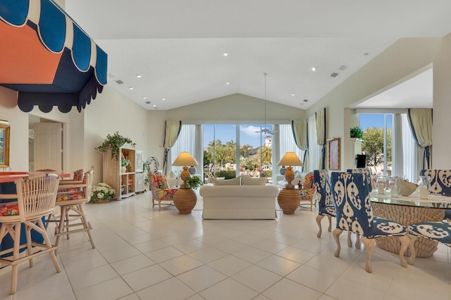 living room with vaulted ceiling, light tile patterned flooring, visible vents, and recessed lighting