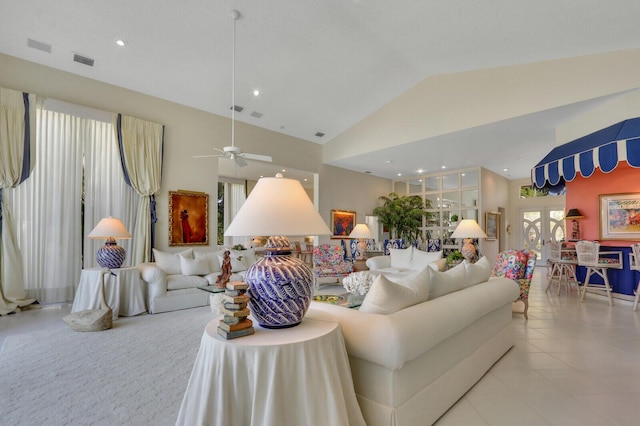 living room with light tile patterned floors, high vaulted ceiling, visible vents, and recessed lighting