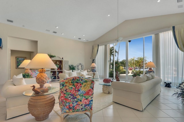 living area with ceiling fan, light tile patterned floors, recessed lighting, visible vents, and vaulted ceiling