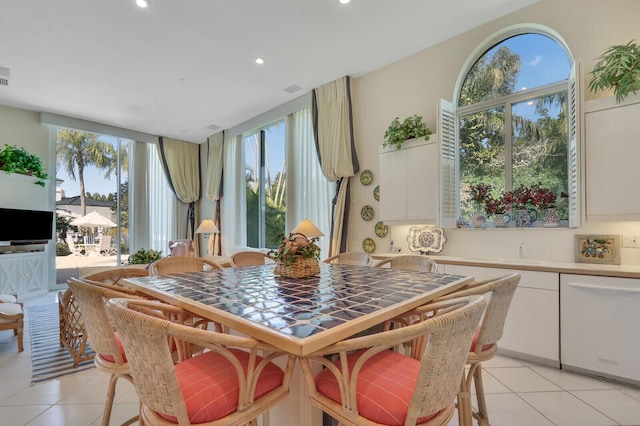 dining room featuring light tile patterned floors, visible vents, and recessed lighting