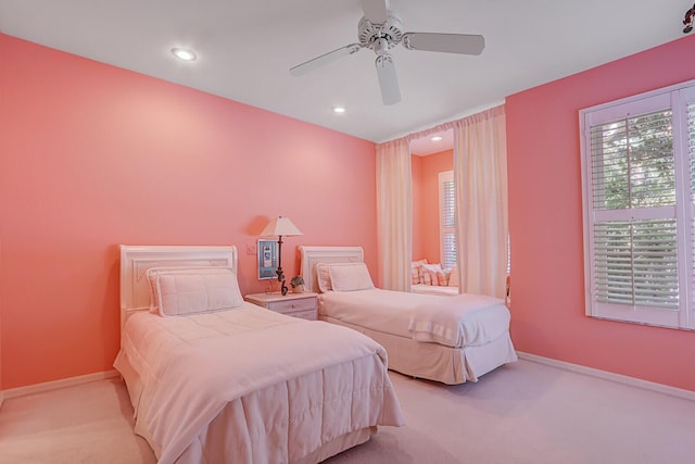 bedroom with light colored carpet and ceiling fan