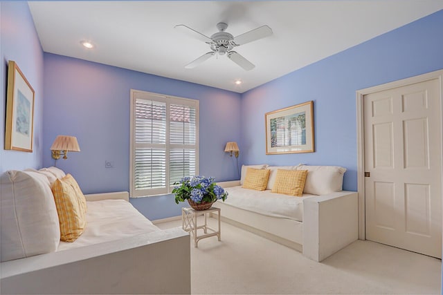 living room featuring light carpet, a ceiling fan, and recessed lighting