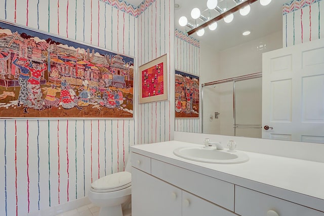 bathroom featuring vanity, an enclosed shower, and toilet