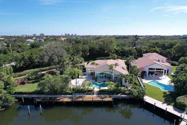 birds eye view of property with a water view