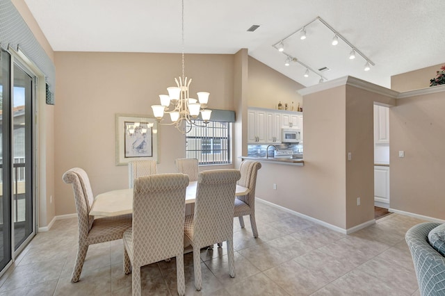 dining room with visible vents, baseboards, vaulted ceiling, light tile patterned flooring, and a notable chandelier