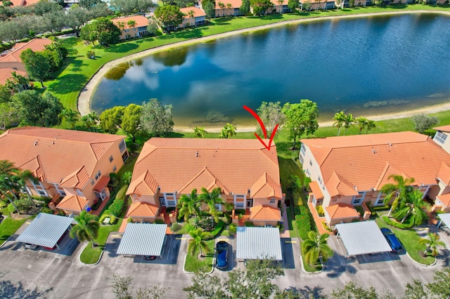 bird's eye view with a residential view and a water view