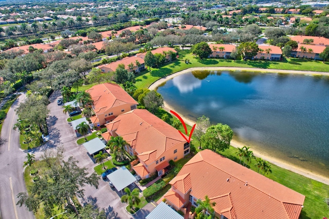 bird's eye view featuring a residential view and a water view