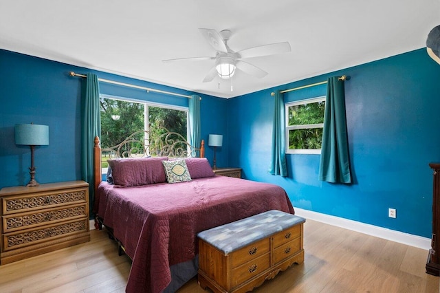 bedroom featuring light hardwood / wood-style floors and ceiling fan