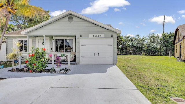 view of front of property featuring a garage and a front yard