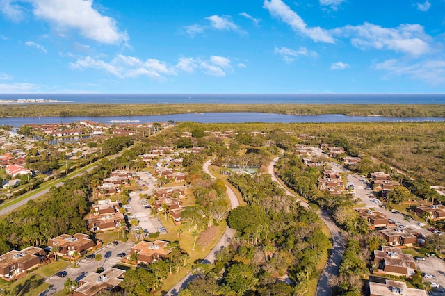 bird's eye view with a water view