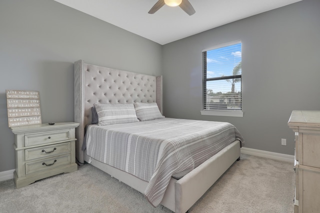bedroom featuring light carpet and ceiling fan