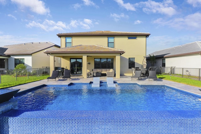 view of swimming pool featuring an outdoor living space and a patio