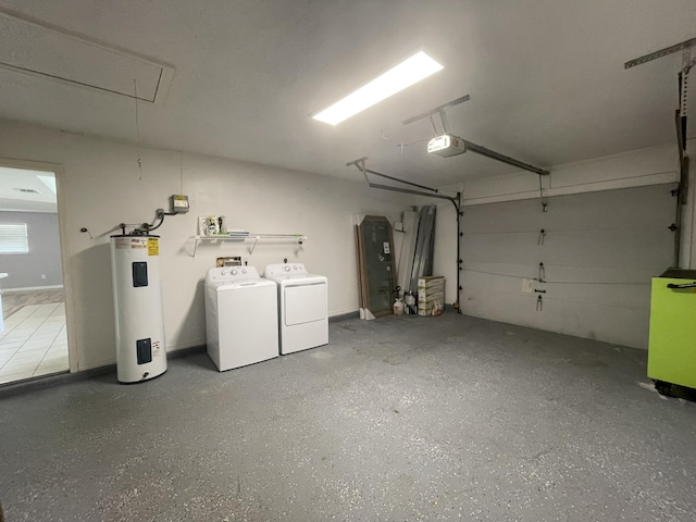 garage featuring a garage door opener, washing machine and dryer, and electric water heater