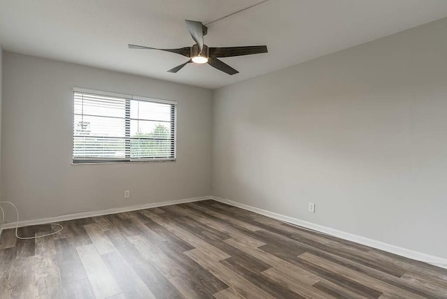 empty room featuring dark hardwood / wood-style floors and ceiling fan