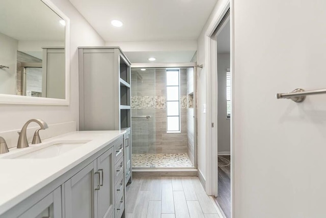 bathroom with vanity and an enclosed shower