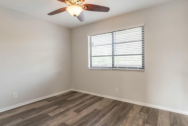 unfurnished room with dark hardwood / wood-style floors and ceiling fan