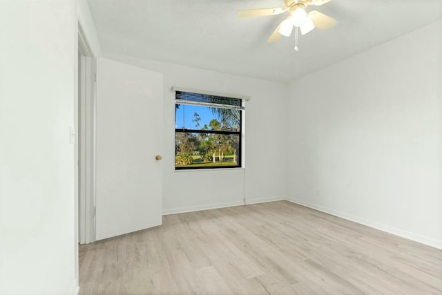 empty room featuring light hardwood / wood-style flooring and ceiling fan