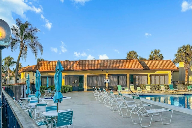 view of swimming pool featuring a patio area