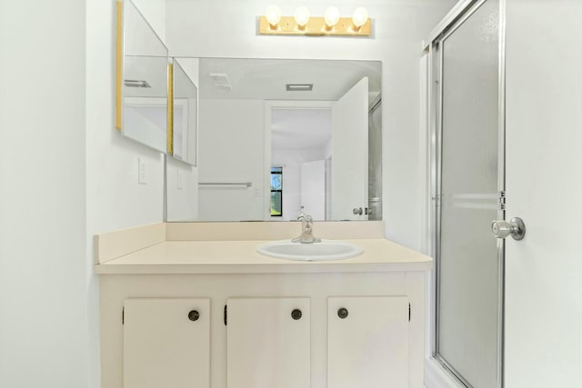 bathroom featuring vanity and walk in shower