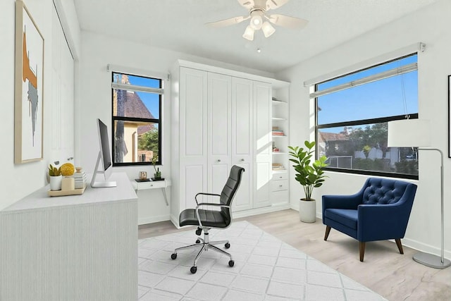 home office featuring ceiling fan and light wood-type flooring