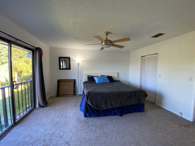 bedroom with carpet, a textured ceiling, access to exterior, and ceiling fan