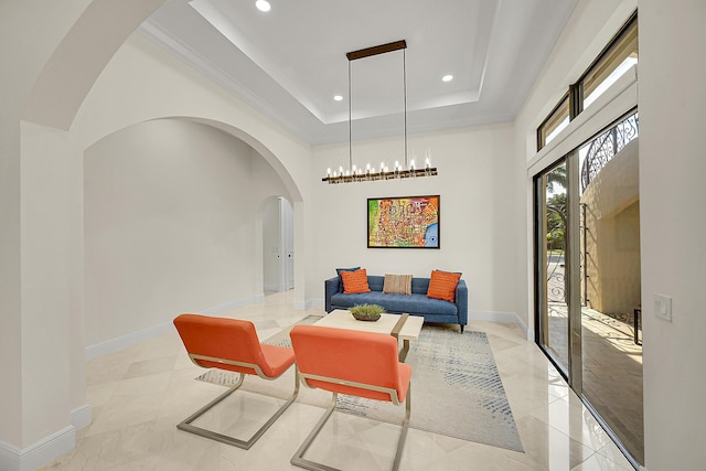 living room featuring a tray ceiling