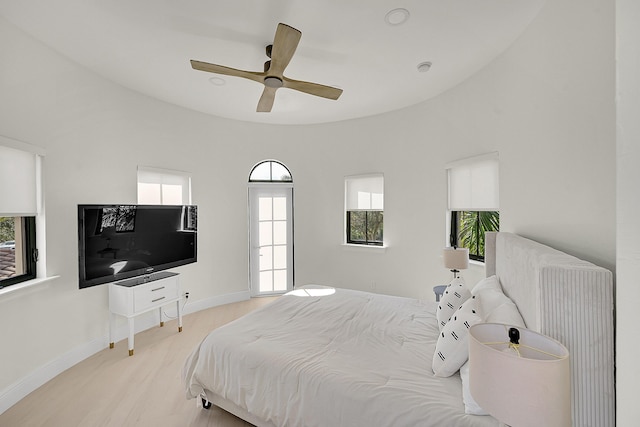 bedroom with radiator heating unit and ceiling fan