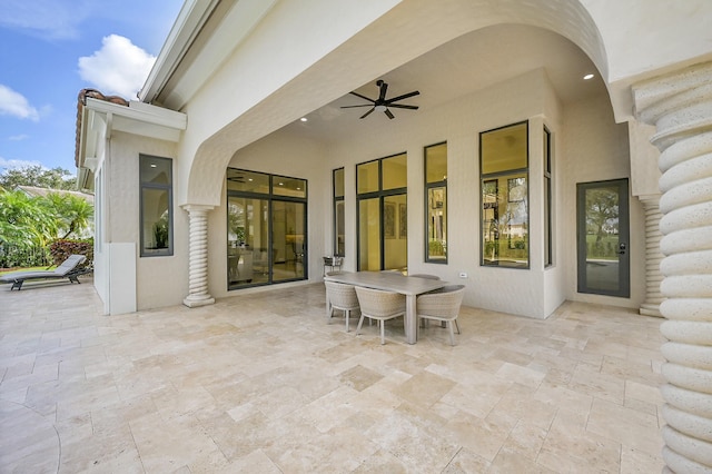 view of patio featuring ceiling fan