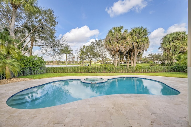 view of swimming pool featuring an in ground hot tub and a patio